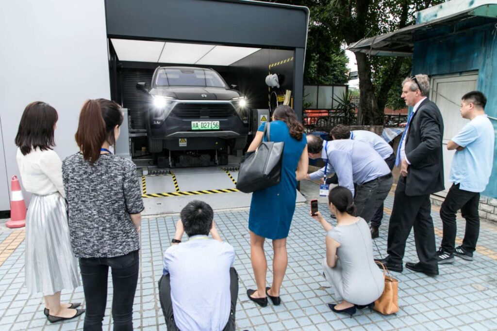 NIO, A CHINESE ELECTRIC CAR MANUFACTURER, SHOWCASING AN EV BATTERY SWAPPING STATION. PHOTO CREDIT: NEW ENERGY NEXUS