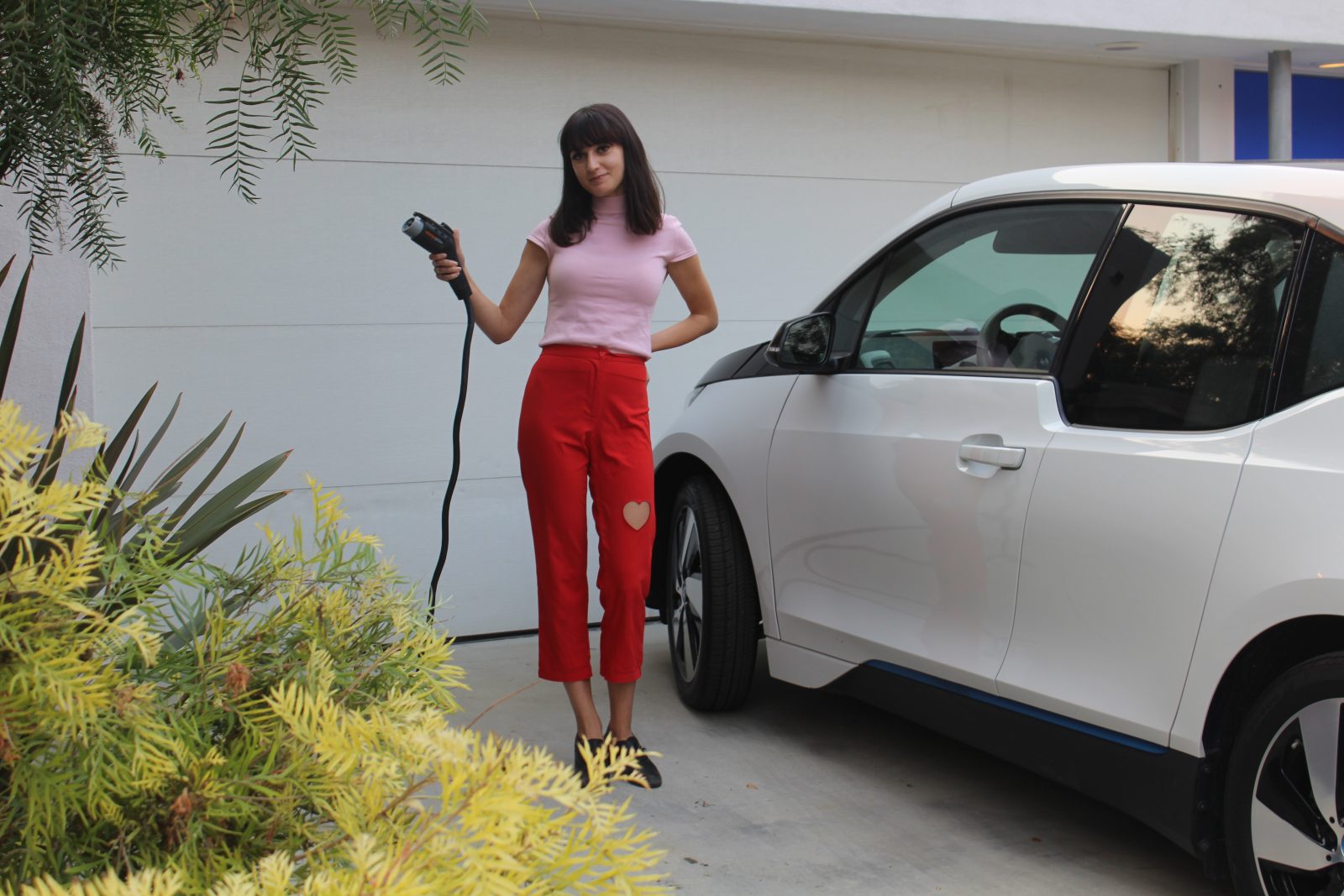 image Woman holding EV Charger Plug