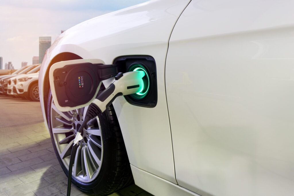 EV Charger plugged into white car