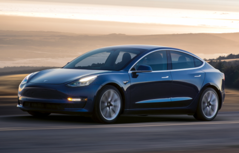 Blue Tesla Car on the road