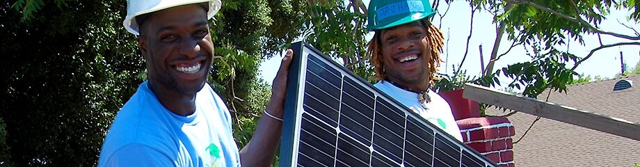 2 men with solar panel